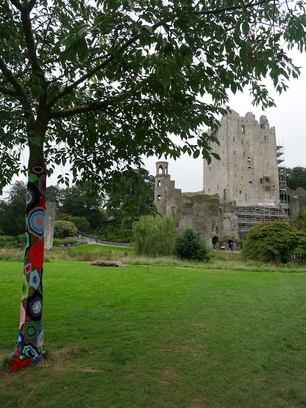 Blarney castle with tree with crochet decoration in front