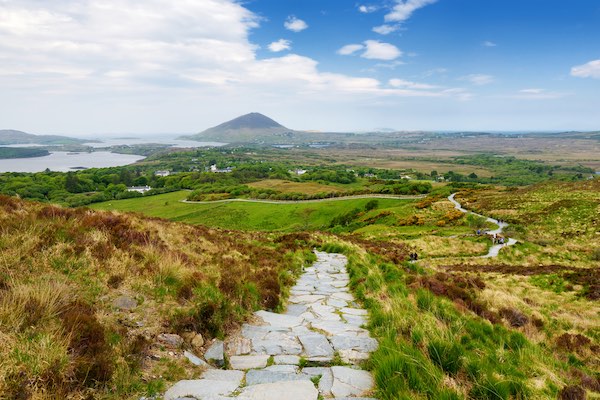 mountain path in Connemara with water and mountain in the background